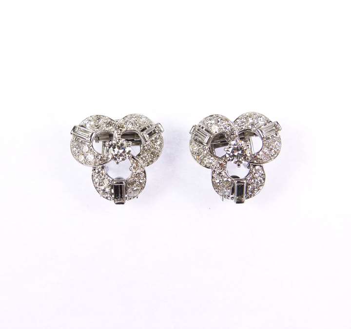 Pair of diamond set trefoil cluster clips by Cartier with later detachable clip earring fittings